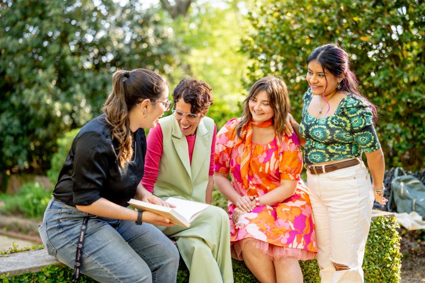 Students laugh in a garden