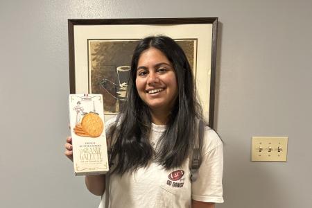 Poorvaja Joganpalli holding up her prize